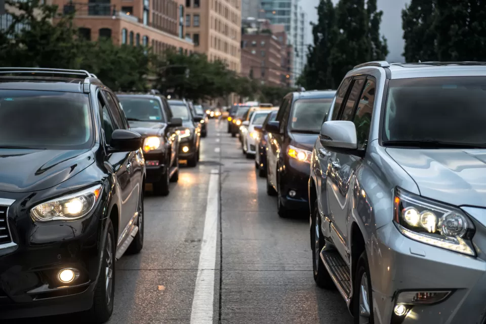 Close-up of black and gray SUVs in New York City traffic